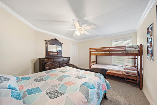 bedroom with carpet flooring, a ceiling fan, baseboards, visible vents, and crown molding