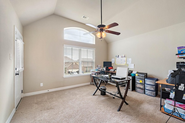 carpeted office space with lofted ceiling, ceiling fan, visible vents, and baseboards