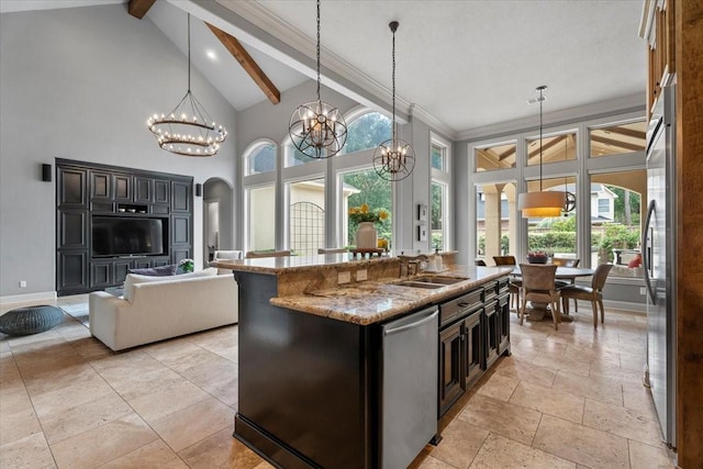 kitchen with beamed ceiling, appliances with stainless steel finishes, baseboards, and an inviting chandelier