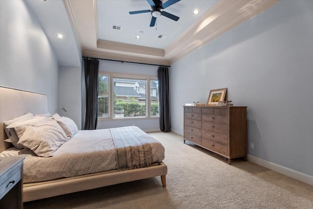 bedroom featuring baseboards, a raised ceiling, light carpet, and ornamental molding