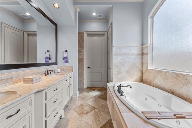 bathroom featuring a sink, a whirlpool tub, ornamental molding, and double vanity