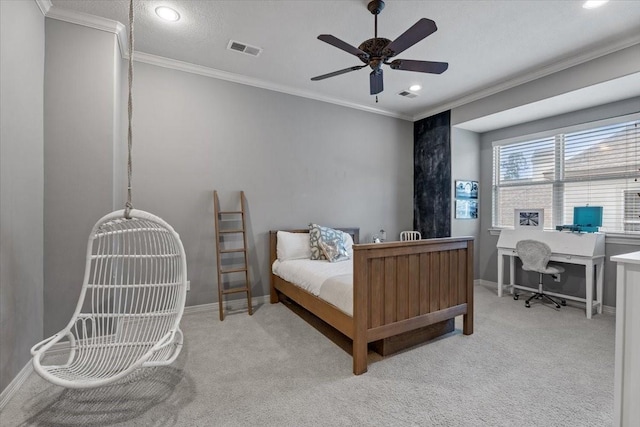 carpeted bedroom featuring crown molding, baseboards, visible vents, and ceiling fan