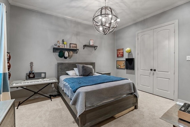 carpeted bedroom with a closet, a notable chandelier, and ornamental molding