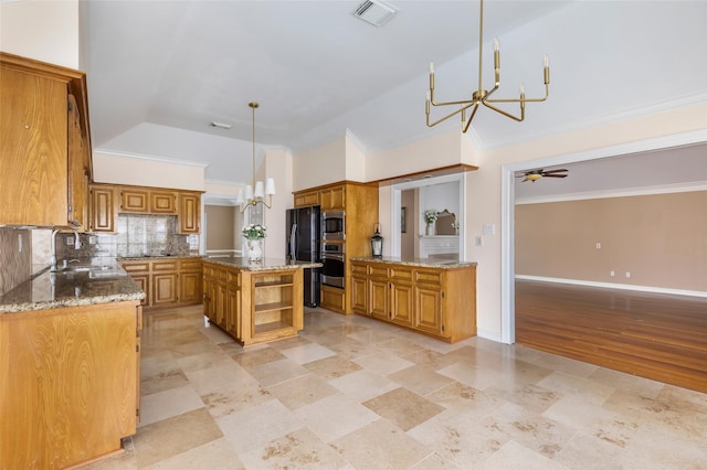 kitchen with brown cabinetry, visible vents, appliances with stainless steel finishes, and decorative backsplash