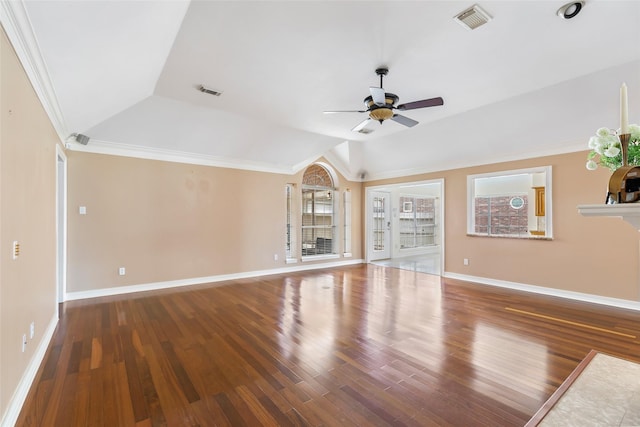 unfurnished living room with lofted ceiling, wood finished floors, visible vents, and ornamental molding