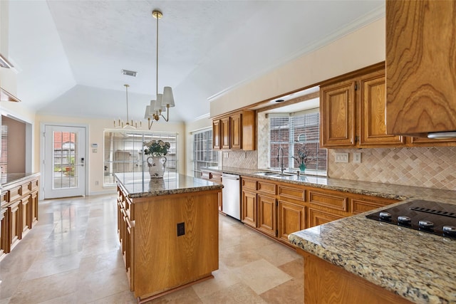 kitchen featuring a sink, dishwasher, brown cabinetry, and a center island