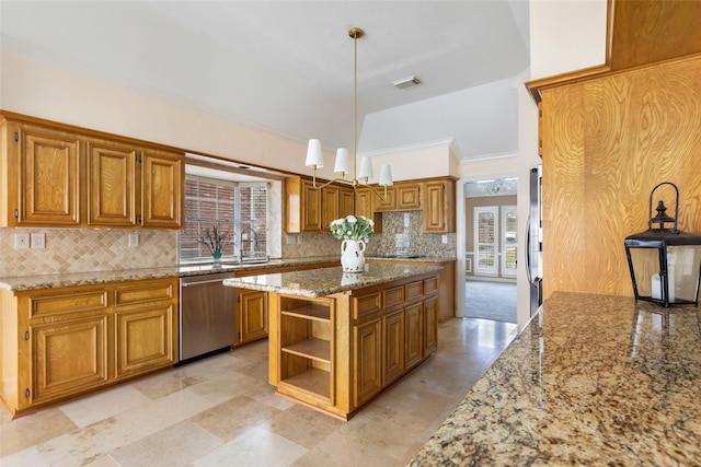 kitchen with visible vents, brown cabinets, tasteful backsplash, stainless steel appliances, and light stone countertops