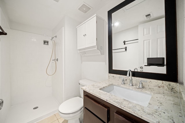 full bathroom with toilet, visible vents, a tile shower, and vanity