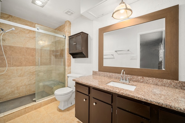 bathroom featuring visible vents, toilet, tile patterned flooring, vanity, and a shower stall