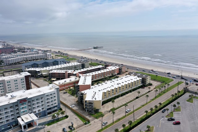 aerial view with a water view, a city view, and a view of the beach