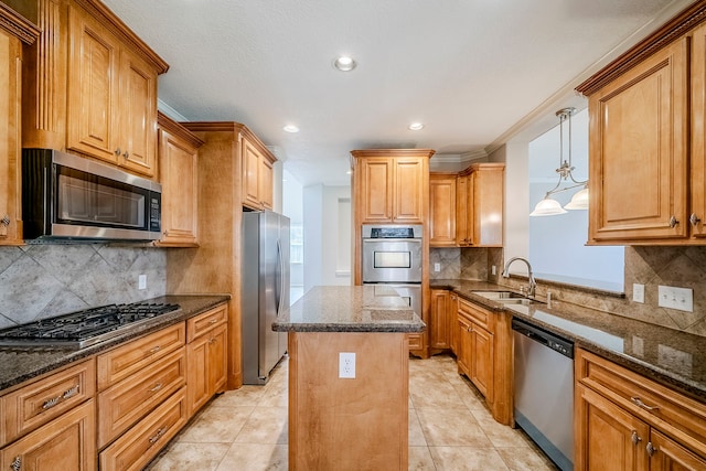 kitchen featuring light tile patterned floors, stainless steel appliances, a kitchen island, a sink, and dark stone counters