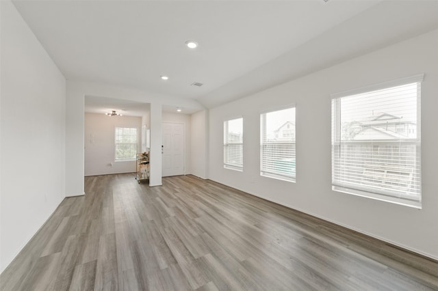 unfurnished living room featuring recessed lighting and light wood finished floors