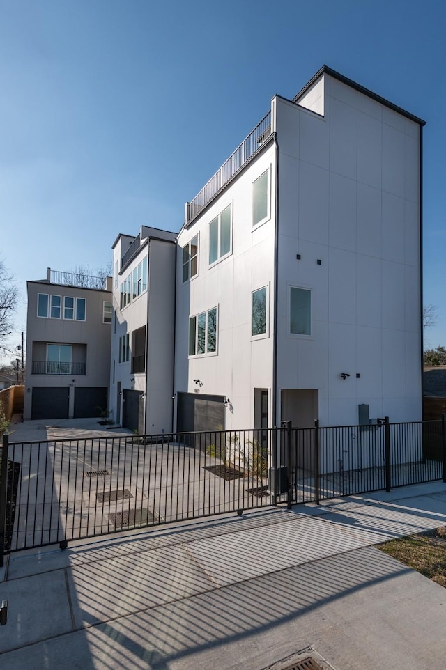 view of property with fence