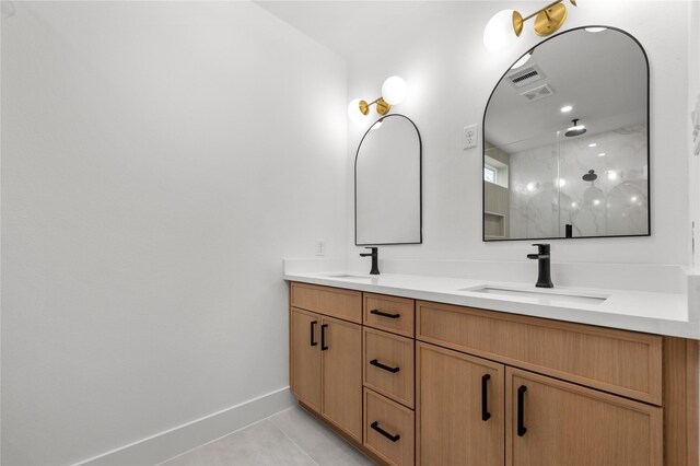 full bathroom with tile patterned flooring, a walk in shower, a sink, and double vanity