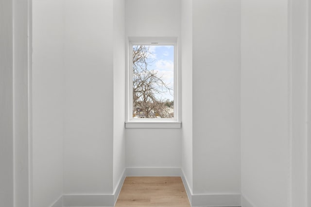 details with baseboards and wood finished floors