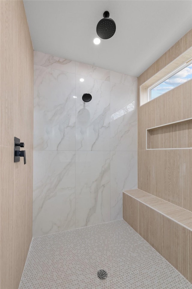 bathroom with a tile shower