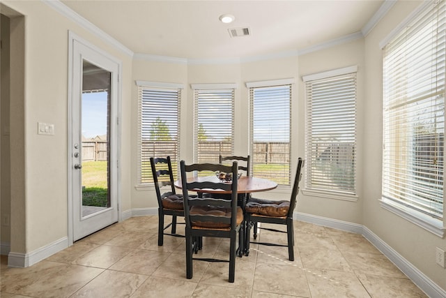 dining room with ornamental molding, light tile patterned flooring, visible vents, and baseboards