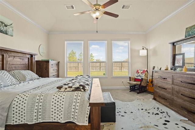 bedroom with multiple windows, light colored carpet, visible vents, and crown molding