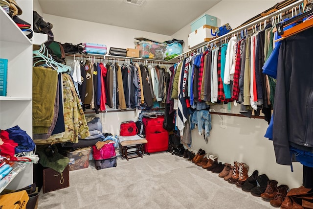 spacious closet with carpet flooring and visible vents