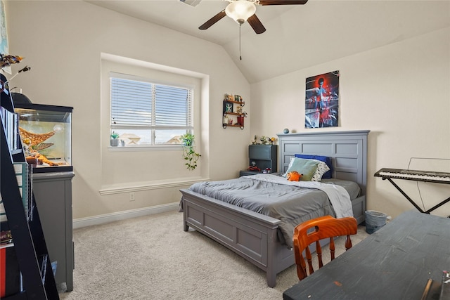 bedroom featuring ceiling fan, baseboards, vaulted ceiling, and light colored carpet