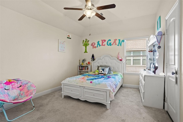 bedroom with light carpet, vaulted ceiling, a ceiling fan, and baseboards