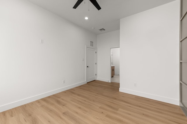 unfurnished bedroom featuring visible vents, light wood-style flooring, and baseboards