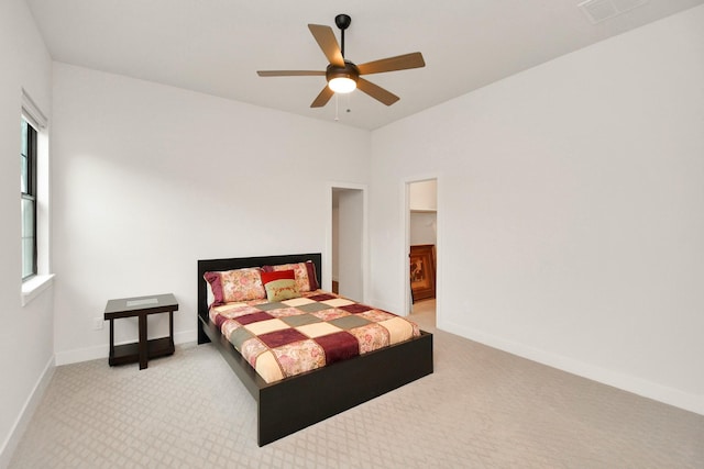 bedroom featuring ceiling fan, carpet, visible vents, and baseboards