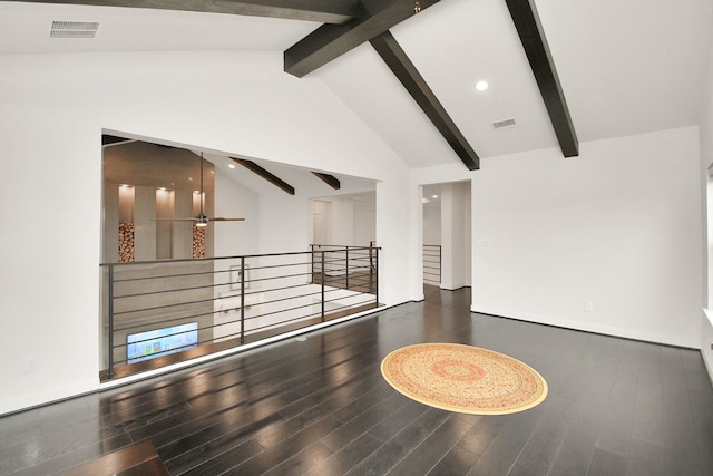 spare room featuring ceiling fan, beamed ceiling, wood finished floors, and visible vents