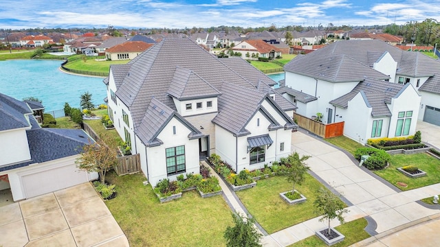 aerial view with a water view and a residential view