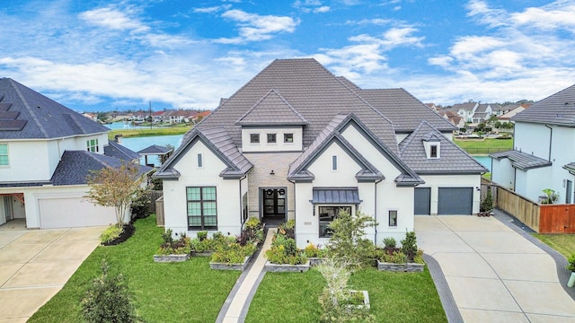 view of front of property featuring a residential view, driveway, a front lawn, and fence