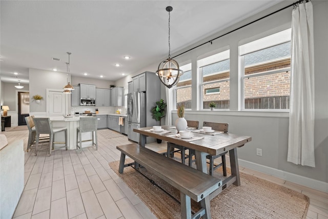 dining space with baseboards, visible vents, and recessed lighting