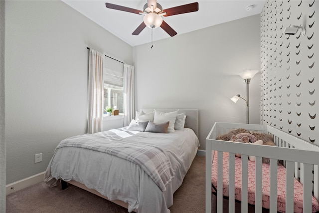 bedroom featuring carpet floors, baseboards, and a ceiling fan