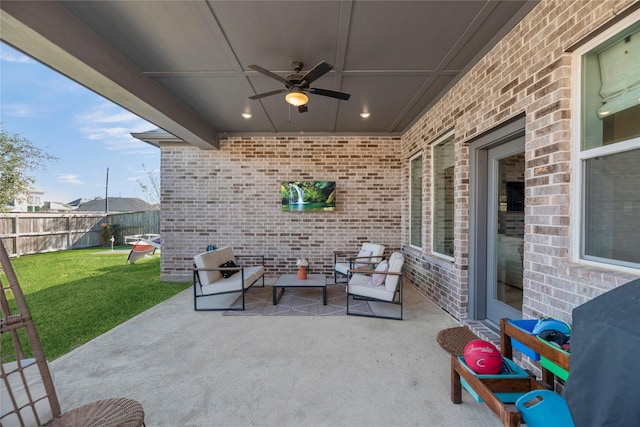 view of patio featuring ceiling fan, fence, and area for grilling