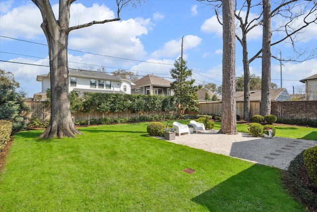 view of yard featuring a patio and fence