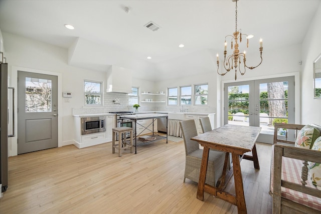 dining space with recessed lighting, visible vents, baseboards, french doors, and light wood-type flooring