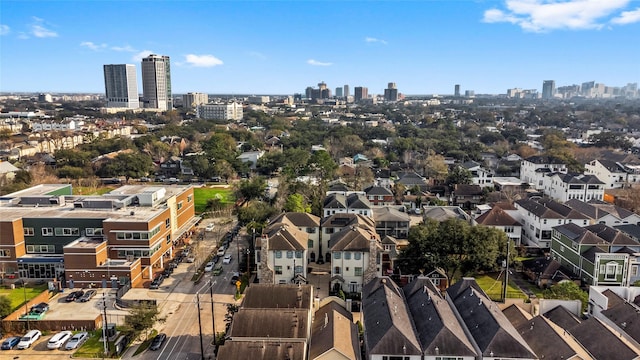 birds eye view of property featuring a city view