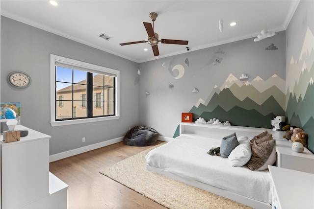 bedroom with recessed lighting, wood finished floors, visible vents, baseboards, and crown molding