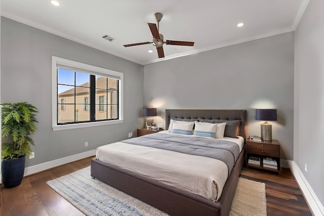 bedroom with recessed lighting, visible vents, ornamental molding, wood finished floors, and baseboards