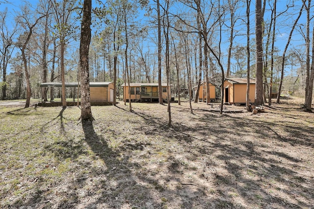 view of yard with a shed and an outdoor structure