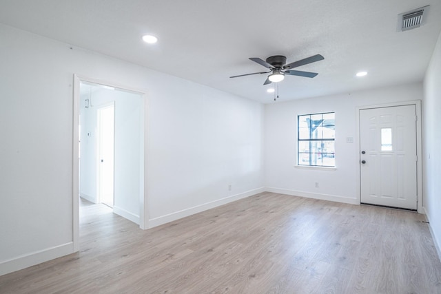 unfurnished room featuring recessed lighting, visible vents, light wood-style flooring, ceiling fan, and baseboards