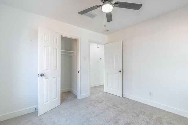 unfurnished bedroom featuring a closet, carpet, visible vents, and baseboards