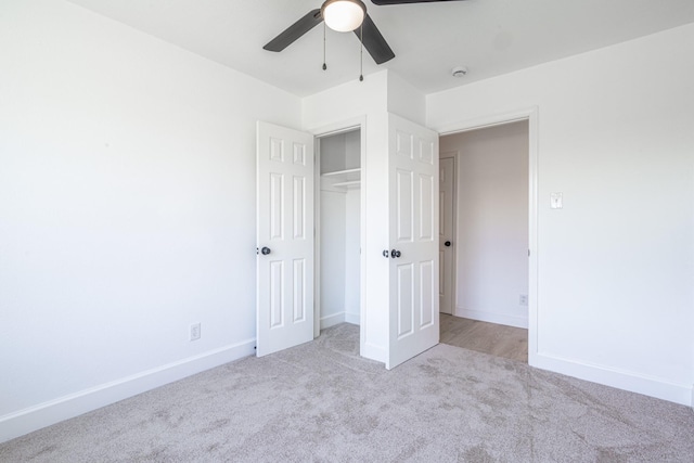 unfurnished bedroom with a ceiling fan, a closet, carpet flooring, and baseboards