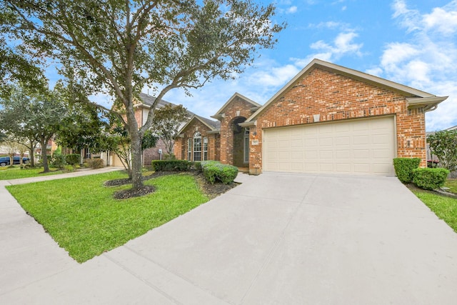 view of front of property featuring concrete driveway, brick siding, an attached garage, and a front yard