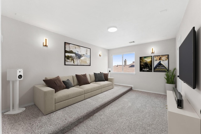 carpeted living area with visible vents and baseboards