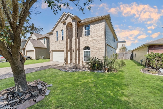 view of front of house featuring an attached garage, brick siding, fence, driveway, and a front yard