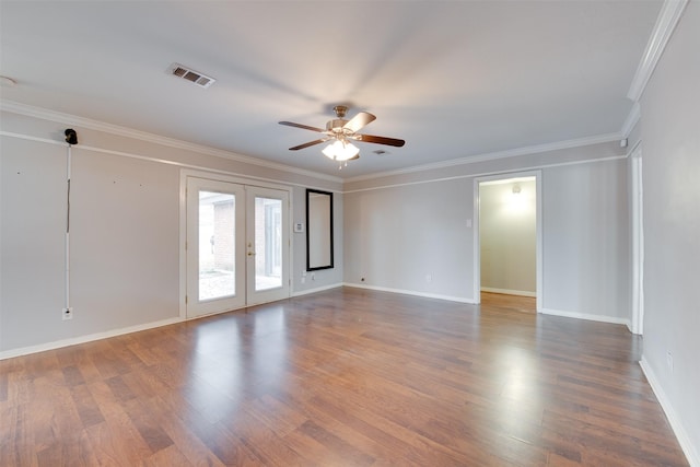 empty room featuring french doors, wood finished floors, visible vents, and a ceiling fan