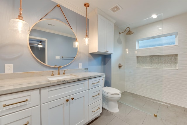 bathroom with toilet, visible vents, walk in shower, and vanity