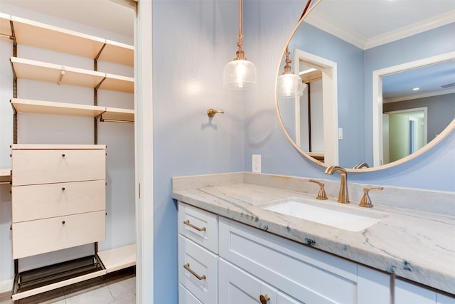 bathroom featuring tile patterned floors, vanity, and crown molding