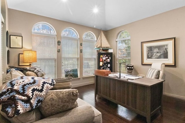 office area with baseboards, dark wood-type flooring, and a wealth of natural light