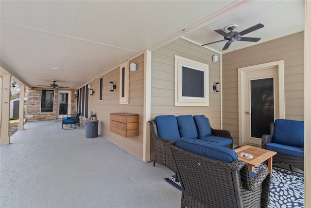 view of patio with a ceiling fan and an outdoor living space